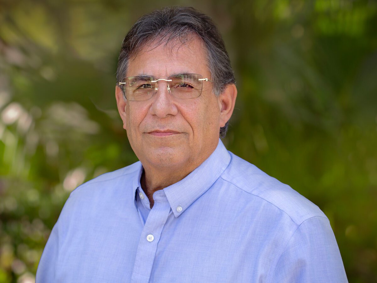 A man in glasses and a blue shirt