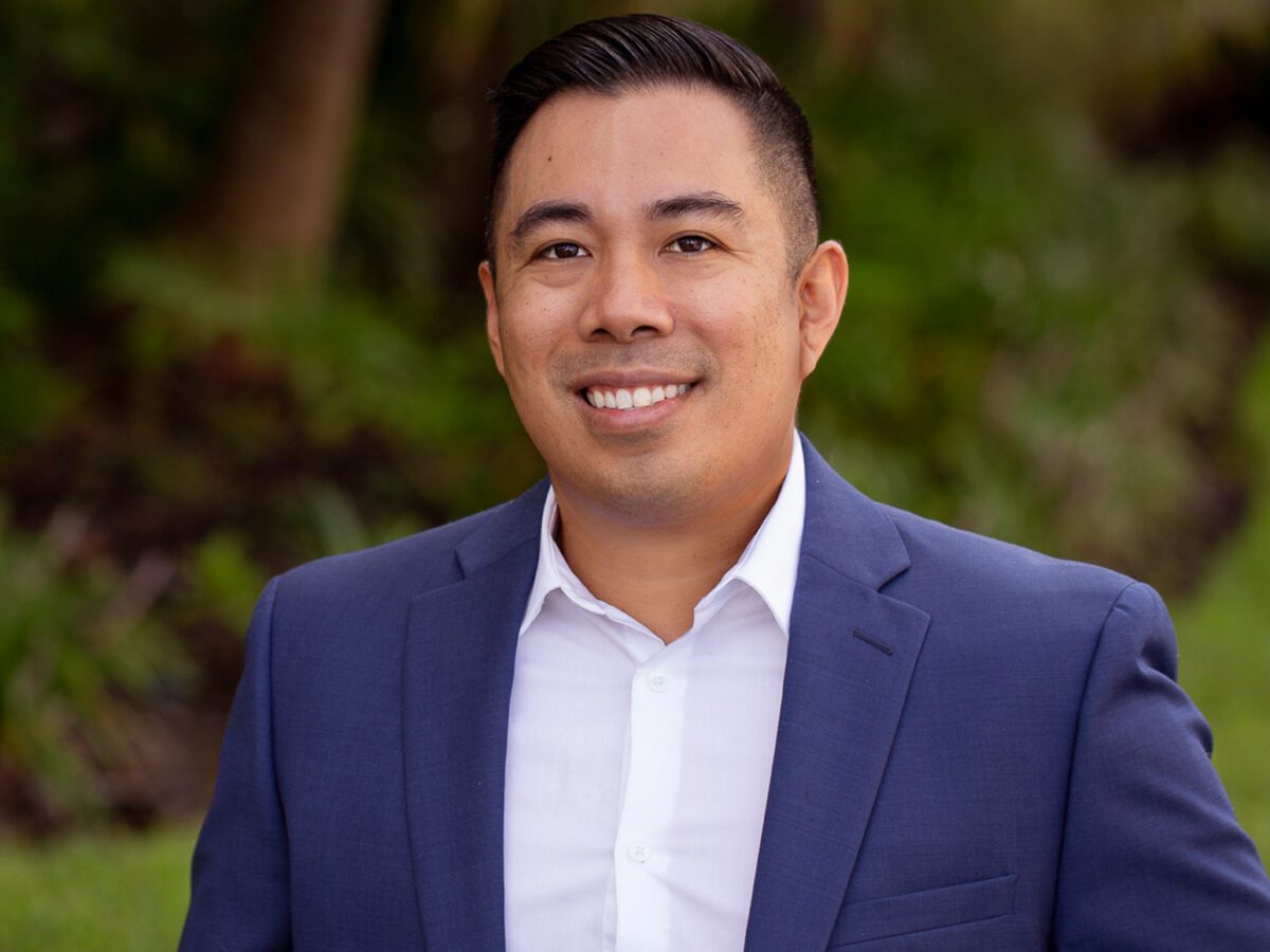 Business portrait of smiling man outdoors