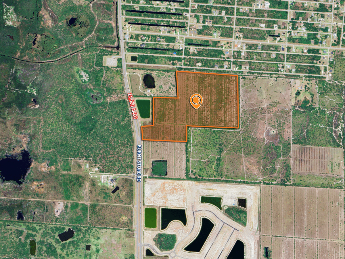 Aerial view of marked land plot.
